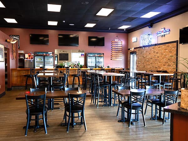 View of the main dining and bar areas at Jay’s Smokin BBQ in Punta Gorda